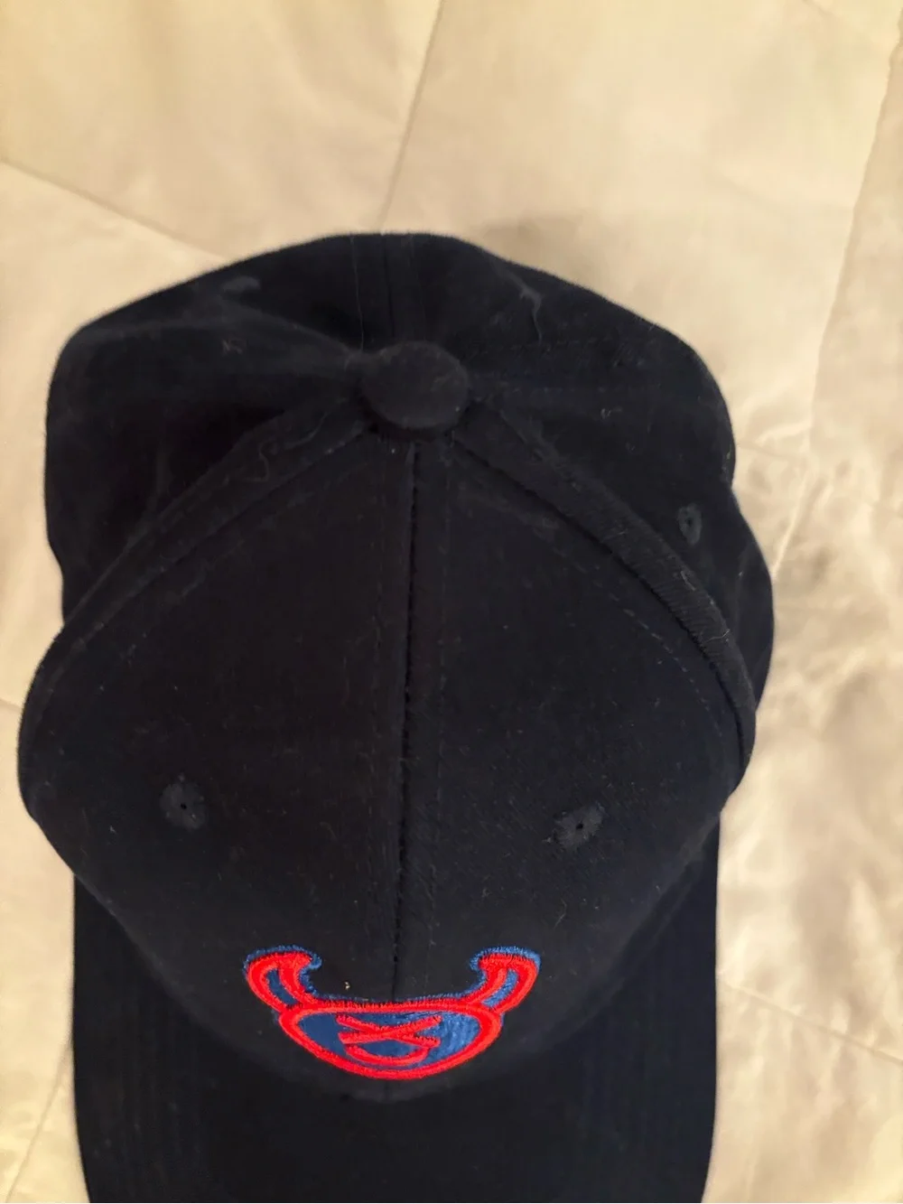 Source Unknown Black Cap with Red & Blue Devil Emblem